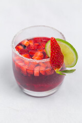 Classic frozen strawberry and lime margarita with fresh strawberries. Valentine's dessert recipe. Strawberry juice.