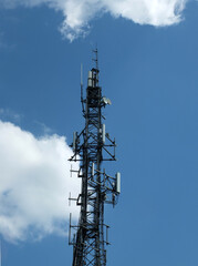 telecommunication mast with mobile phone antennas relay equipment and terrestrial tv arials