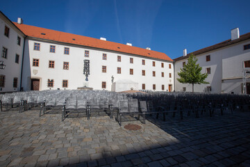 Wire chairs to sit in the courtyard in front of the stage.