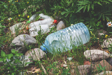 Obraz premium environmental pollution, ecological problem, spilled plastic bottles, garbage on the ground, waste, earth, ocean pollution