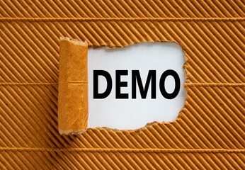 The word 'demo' appearing behind torn brown paper. Business concept. Copy space.