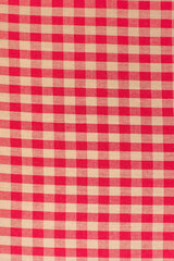 Close up of a red and white checkered tablecloth