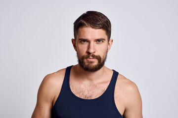 Fototapeta na wymiar portrait of a man in a T-shirt on a light background massager scalp care model