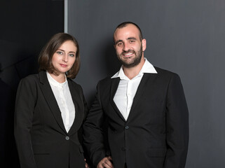 Business people during meeting in board room. Colleagues at business meeting in conference room. Always brainstorming. Smiling colleagues working in office discussing papers
