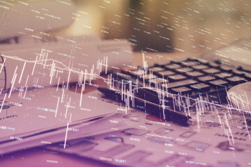 Double exposure of financial chart drawings and desk with open notebook background. Concept of forex market