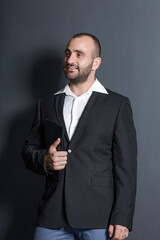 Fashion man in suit. Business Concept - Portrait Handsome Business man holding hands with confident face.