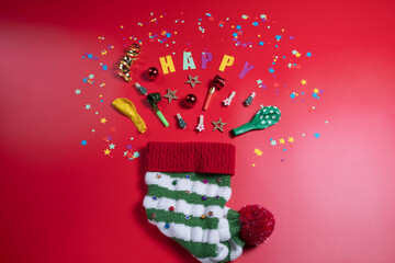 elements for the festive decoration fly out like fireworks from a New Year's elf hat. Flatlay on a...