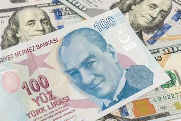 Close-up Turkish One Hundred Lira and US One Hundred Dollars banknote. 
