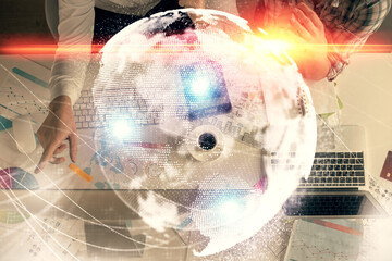 Double exposure of man and woman working together and business theme hologram drawing. Computer...