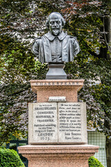 A bust of William Shakespeare (1896) in St Mary Aldermanbury Garden. Bust is a memorial to John...
