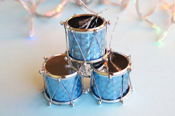 Obraz na płótnie Canvas Christmas decoration for the Christmas tree in the form of drums on a blue background.