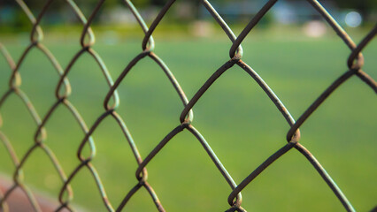 Fototapeta premium Astroturf corner surrounded by iron wires