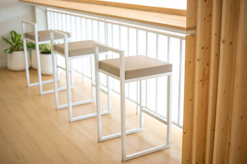 Chairs or stools in front of counter bar