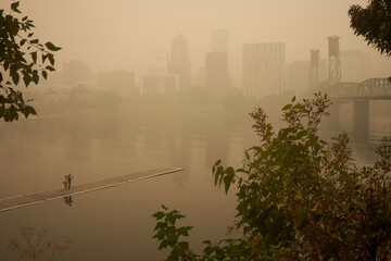 An orange smoke-filled sky is seen above Portland's downtown skyline during the Oregon wildfires.