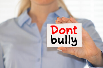 top view of wooden blocks with dont bully lettering on grey background