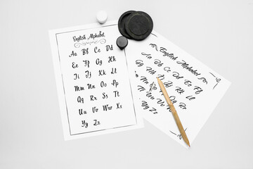 Supplies for calligraphy practice on white background