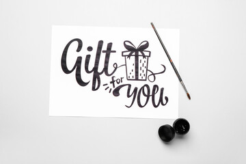 Supplies for calligraphy practice on white background