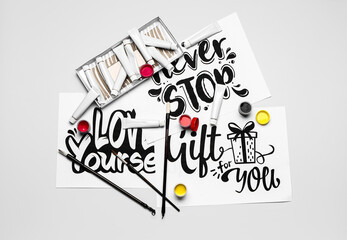 Supplies for calligraphy practice on white background