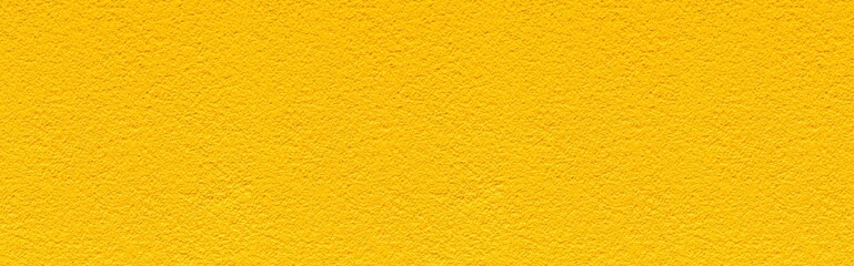 Panorama of Rough patterned yellow cement wall texture and seamless background