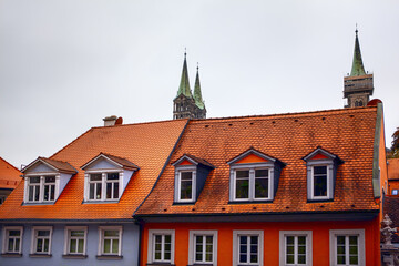 Fototapeta na wymiar house with attics and tiled roof