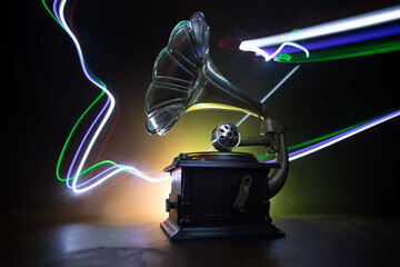 Old gramophone on a dark background. Music concept