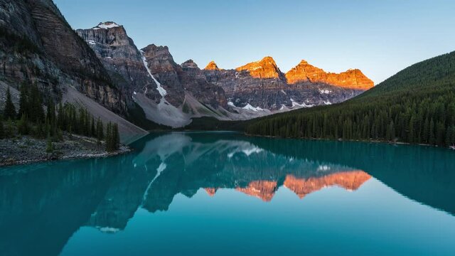 Zoom in timelapse view of sunrise over Moraine Lake and Valley of the Ten Peaks in Banff National Park, Alberta, Canada. 
