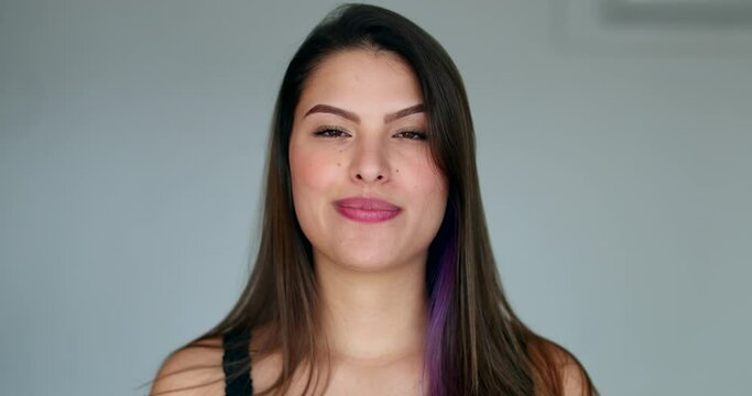 Assertive woman removing tape from mouth feeling relief and freedom to speak