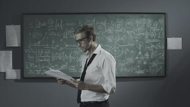 Cheerful mathematician solving a problem and celebrating