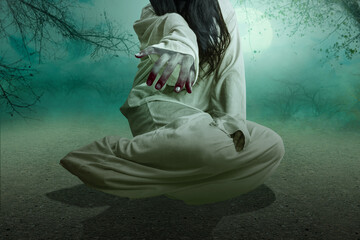 Scary ghost woman crawling with night scene background