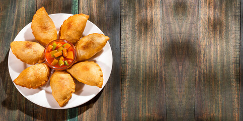 Traditional baked Argentinian empanadas savoury pastries with meat beef stuffing