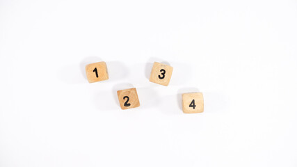 Top view of four wooden dice on white background