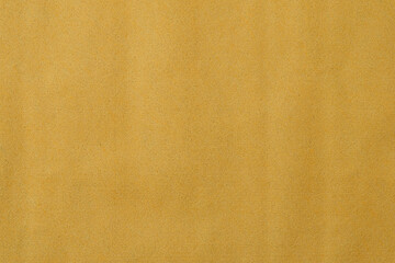 The texture of a yellow-gold disposable textile towel.