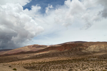 Desert landscape. Majestic view of the arid valley and mountains under a beautiful cloudy sky.