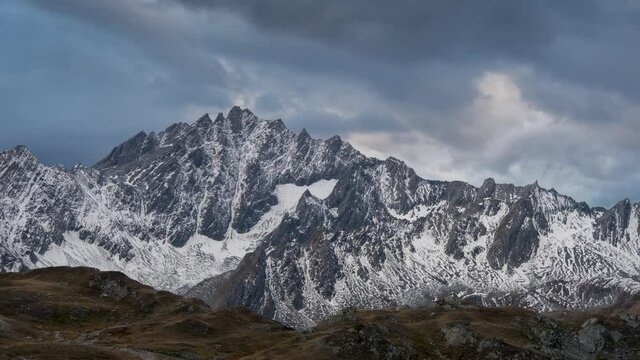 View of snow-capped mountains near Fenetre lakes in Switzerland. Time lapse