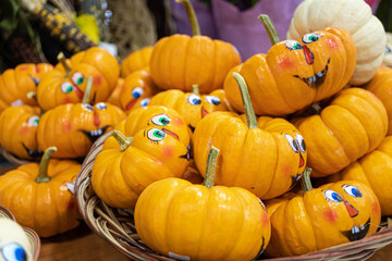 Deocrative face pained pumpkins on display at shop