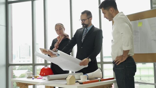 Group engineering with technical leader or manager working and meeting together, Project planner or architecture discussion with team