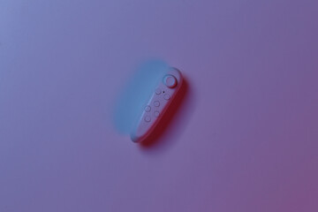 Modern joystick in blue pink neon light. Top view