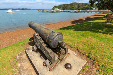 An old cannon on the waterfront at Russell in the Bay of Islands, New Zealand. It was used to defend the town in the 1840s