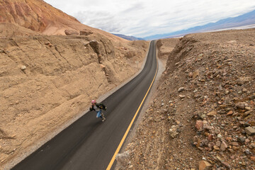 woman in a jacket running on a highway road