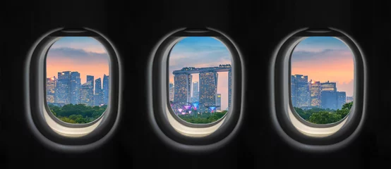 Tableaux ronds sur aluminium brossé Avion View outside the plane window. Singapore City.