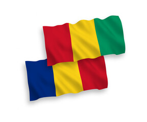 Flags of Romania and Guinea on a white background