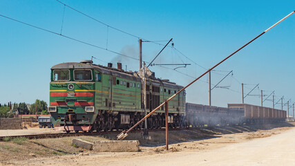 Old diesel locomotive with wagons