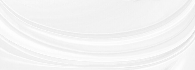 White gray satin texture that is white silver fabric silk panorama background with beautiful soft blur pattern natural.
