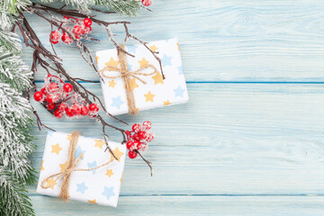 Christmas gift boxes over blue background