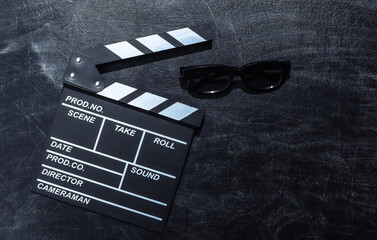 Movie clapper board and 3d glasses on chalk blackboard. Cinema industry, entertainment