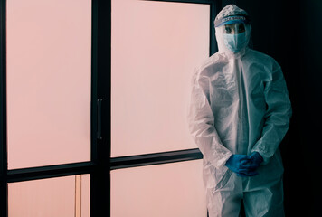 Doctor standing in a protective suit	