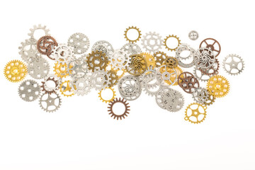 A large group of rusty transmission gears linked together on a white background.