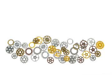 A large group of rusty transmission gears linked together on a white background.