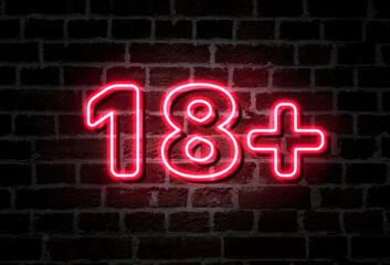 Fototapeta na wymiar 18 + neon sign on brick wall, concept picture
