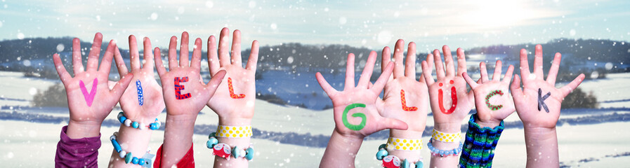 Kids Hands Holding Colorful German Word Viel Glueck Means Good Luck. Snowy Winter Background With...